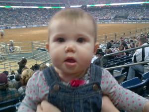Kendlyll with the Houston Rodeo ring behind her.