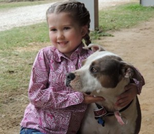 Showing off her hair as she loves on Trapp's dog, Camo.
