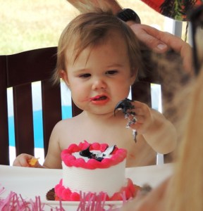 Kendyll Paige with her first birthday Mickey Mouse cake