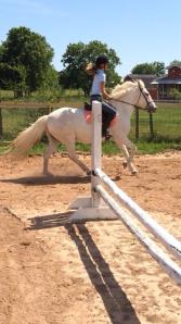 Arianna getting a little gallop out of the pony.
