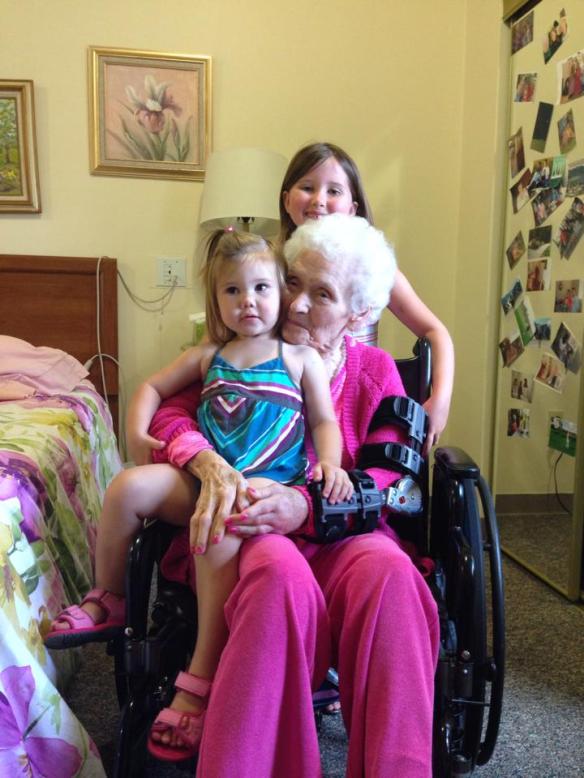 Kendyll getting a kiss from her granny-nanny with Jordyn  behind.