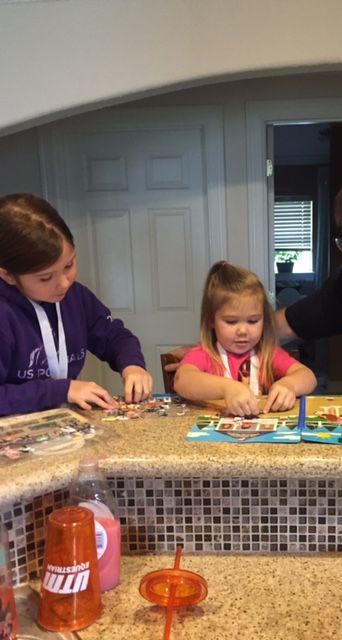 Jo and Ken working on their puzzle book with Chris.
